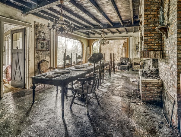 Light floods an abandoned dining room characterised by decay, Maison Limmi, Lost Place, Kalken, Laarne, Province of East Flanders, Belgium, Europe