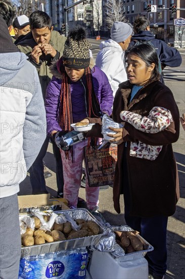 Denver, Colorado, Immigrants, mostly from Venezuela, live in a tent camp near downtown Denver. The city helped about 35, 000 migrants in 2023 with food and temporary shelter, but more continue to arrive daily on buses from the southern border