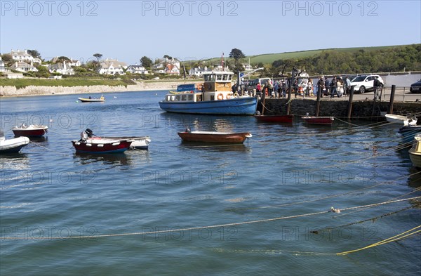 Ferry boat and dinghies in the harbour, St Mawes, Cornwall, England, UK