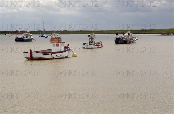 Boats on the River Ore at Orford, Suffolk, England, UK