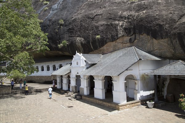 People at Dambulla cave Buddhist temple complex, Sri Lanka, Asia