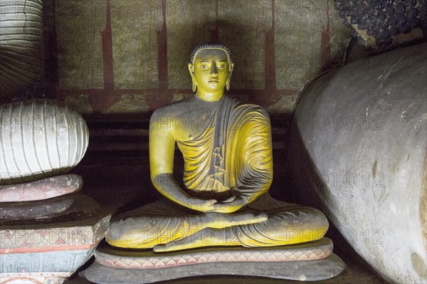 Buddha figure inside Dambulla cave Buddhist temple complex, Sri Lanka, Asia