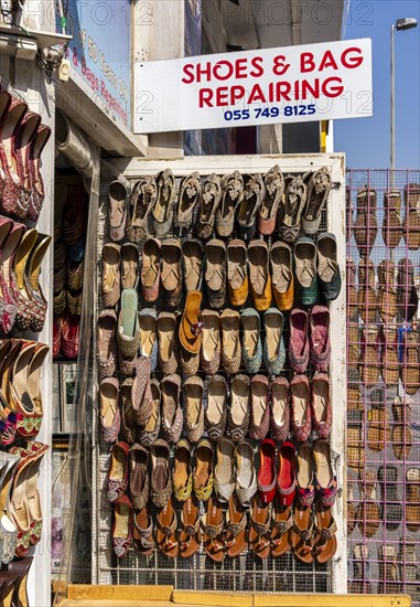 Shoe shops and craftsmen in the Al Fahidi neighbourhood, Dubai, United Arab Emirates, Asia