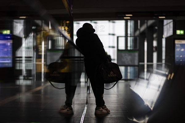 A person stands waiting at Berlin Central Station. Today is the second day of the strike by the train drivers' union GDL, on which train cancellations are to be expected. Berlin, 11.01.2024