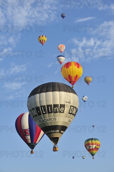 Balloonists, Aeronauts flying in hot-air balloons during ballooning meeting