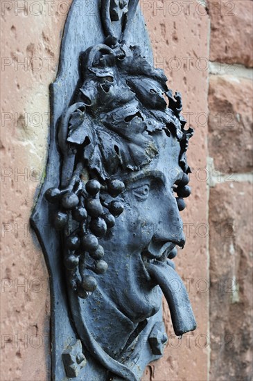 Fountain with Bacchus figure in the vineyards at Dambach-la-Ville, Vosges, Alsace, France, Europe