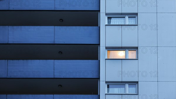 Illuminated room in a tower block in Gropiusstadt. The rise in rents in German cities has increased again in the past year, Berlin, 16.01.2023