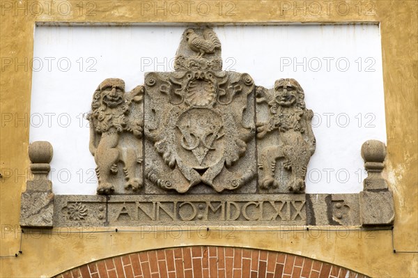 Stone heraldic shield above entrance to the fort area of historic town of Galle, Sri Lanka, Asia