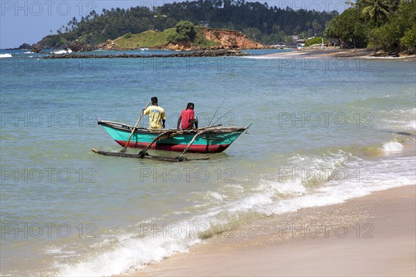 Fishing using traditional outrigger canoes, Mirissa, Sri Lanka, Asia