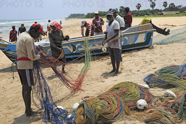 Traditional fishing hauling nets Nilavelli beach, near Trincomalee, Eastern province, Sri Lanka, Asia