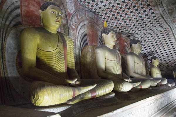 Buddha figures inside Dambulla cave Buddhist temple complex, Sri Lanka, Asia