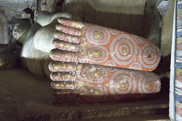 Buddha figure inside Dambulla cave Buddhist temple complex, Sri Lanka, Asia