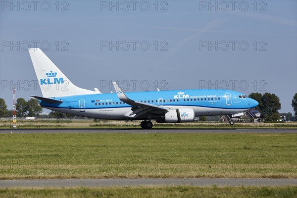 KLM Boeing 737-7K2 with registration PH-BGF lands on the Polderbaan, Amsterdam Schiphol Airport in Vijfhuizen, municipality of Haarlemmermeer, Noord-Holland, Netherlands