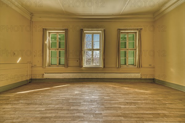 Bright old building room with wooden floor and three windows with closed green shutters, Schachtrupp Villa, Lost Place, Osterode am Harz, Lower Saxony, Germany, Europe