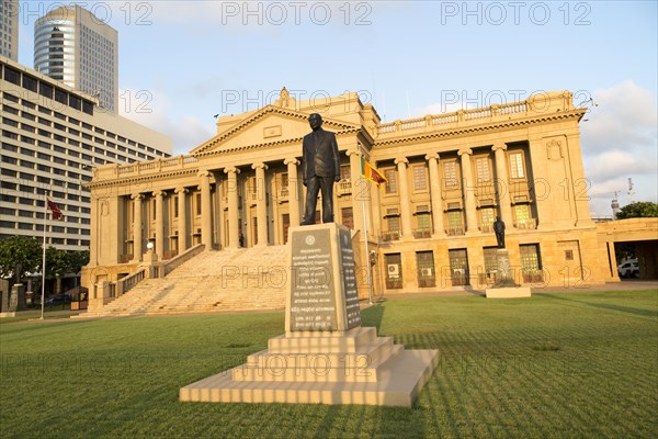 Old Parliament Building now the Presidential Secretariat offices, Colombo, Sri Lanka and modern skyscraper buildings