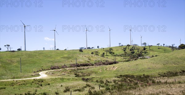 Wind turbines stand on small hill near Nuwara Eliya, Central Province, Sri Lanka, Asia