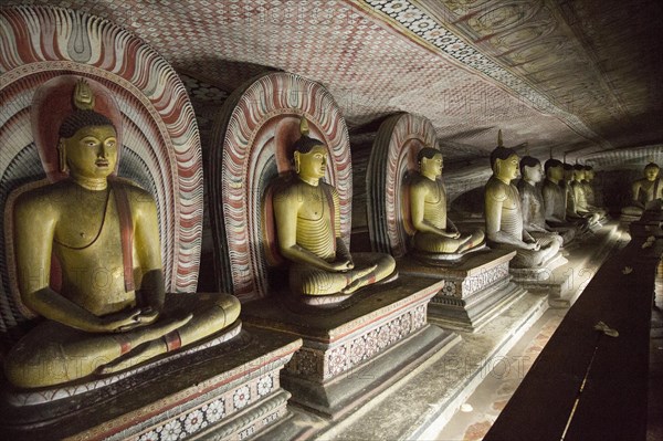 Buddha figures inside Dambulla cave Buddhist temple complex, Sri Lanka, Asia