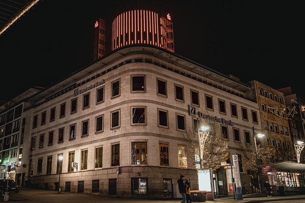 Historic bank building at night with warm street lighting in an urban environment, Pforzheim, Germany, Europe