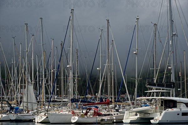 Dense sailboats in the harbour of Horta under a threatening stormy sky, Horta, Faial Island, Azores, Portugal, Europe
