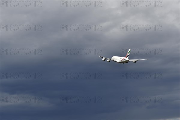 Emirates Airways Airbus A380-800 take-off in storm front with thundercloud, Munich Airport, Upper Bavaria, Bavaria, Germany, Europe