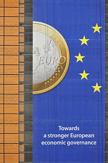 Banner about the euro hanging from the Berlaymont building of the European Commission, executive body of the European Union, Brussels, Belgium, Europe