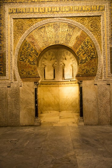 Richly inscribed stonework of keyhole shaped Mihrab, the centrepiece of the Great Mosque, Cordoba, Spain, Europe