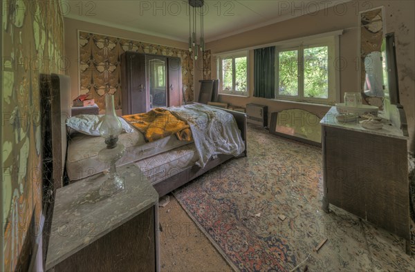 A rumpled bed in an abandoned bedroom bears witness to transience, Maison Limmi, Lost Place, Kalken, Laarne, Province of East Flanders, Belgium, Europe