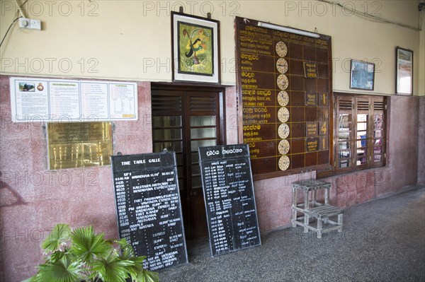 Train timetable at the railway station, Galle, Sri Lanka, Asia