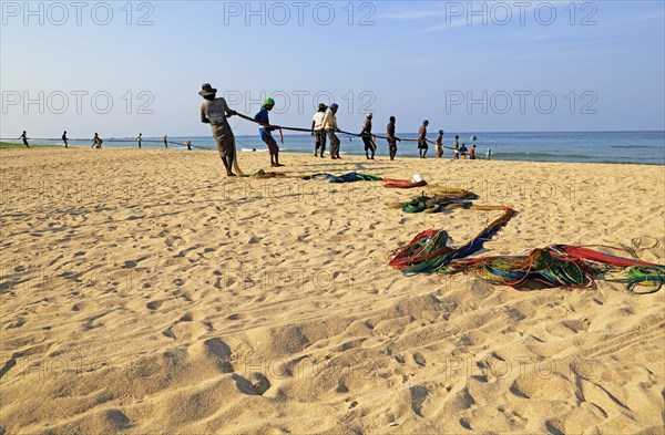 Traditional fishing hauling nets Nilavelli beach, near Trincomalee, Eastern province, Sri Lanka, Asia