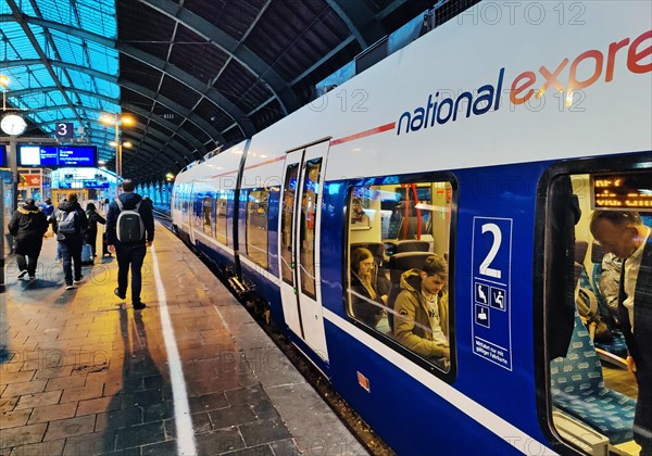 National Express local train on the platform early in the morning at Cologne Central Station, Cologne, North Rhine-Westphalia, Germany, Europe