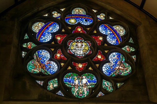 Stained glass window of Adam and Eve in Paradise, Roman catholic church of Saint John the Evangelist, Bath, north east Somerset, England, UK