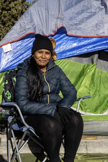 Denver, Colorado, Immigrants, mostly from Venezuela, live in a tent camp near downtown Denver. The city helped about 35, 000 migrants in 2023 with food and temporary shelter, but more continue to arrive daily on buses from the southern border