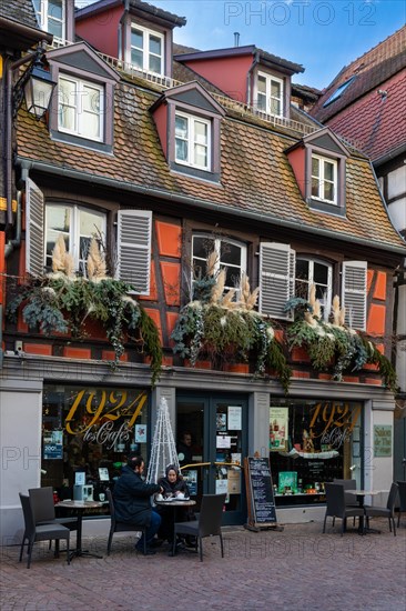 Half-timbered house with Christmas decorations, coffee, Colmar, Alsace, France, Europe