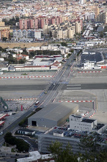 View over airport runway to Spanish town of La Linea from Gibraltar, British overseas territory in southern Europe