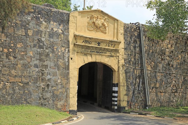 Main gate entrance in walls of historic Fort Frederick, Trincomalee, Sri Lanka, Asia dated 1675 'Dieu et mon Droit' coat of arms, Asia