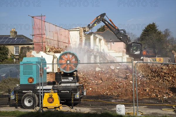 Dehaco water cannon sprayer dampening dust at a demolition site, Woodbridge, Suffolk, England, UK