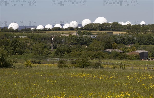 White circular radomes of satellite ground station, RAF Menwith Hill, North Yorkshire, England, UK