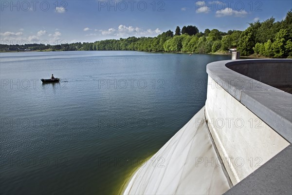 Angler in rowboat on the Buetgenbach reservoir in the Hautes Fagnes, High Fens, Ardennes, Belgium, Europe