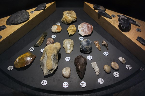 Prehistoric artefacts like flint tools on display in the Cinquantenaire Museum in Brussels, Belgium, Europe