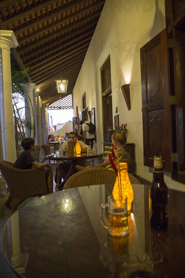 Evening drinks colonial style veranda bar of Galle Fort Hotel, historic town of Galle, Sri Lanka, Asia
