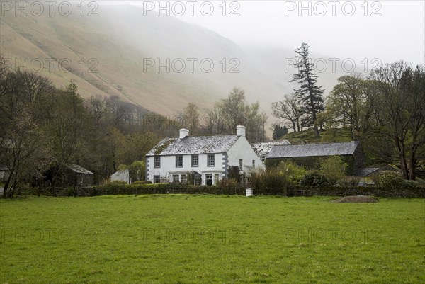 Traditional stone farmhouse at Howtown, Ullswater, Cumbria, England, UK
