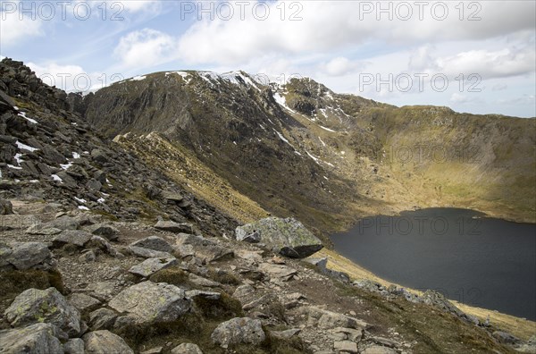 Striding Edge arete Helvellyn mountain peak and Red Tarn corrie lake, Lake District, Cumbria, England, UK