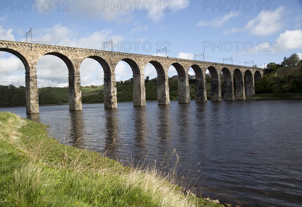 Stone arches of railway viaduct crossing River Tweed, Berwick-upon-Tweed, Northumberland, England, UK