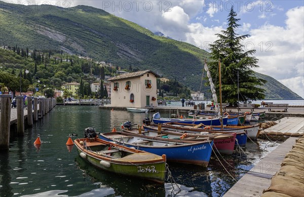 Rowing boats in the harbour, old customs house Casa del Dazio, Torbole, Lake Garda, Trentino, Italy, Europe
