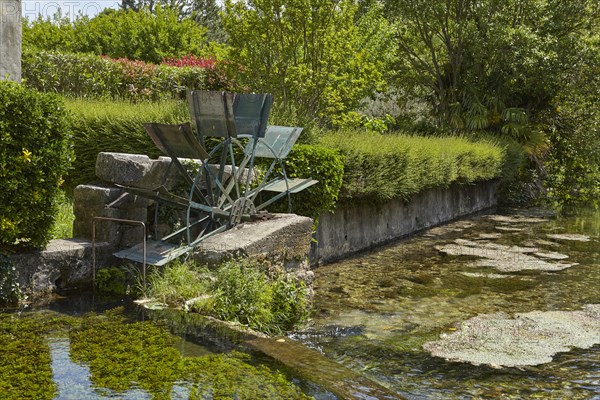 Old mill wheel of a watermill in Goudargues, Departement Gard, Occitanie region, France, Europe