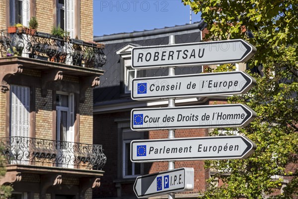 Signpost with directions to the several European Union office buildings in the European quarter at Strasbourg, France, Europe
