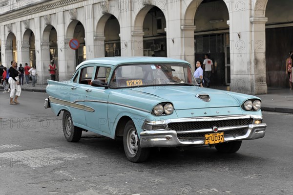 Blue vintage car from the 50s in Avenida Simon Bolivar, Calle Reina, centre of Havana, Centro Habana, Cuba, Greater Antilles, Caribbean, Central America
