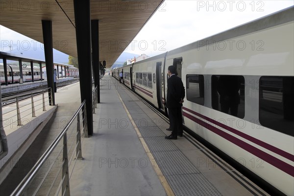 Train awaiting departure on platform at railway station, Algeciras, Cadiz province, Spain, Europe