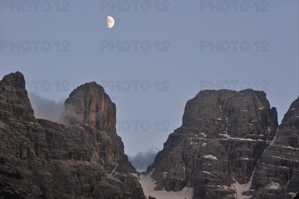 Moon over the mountain Monte Cristallo in the Dolomites, Italy, Europe