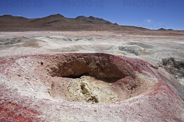 Mud lakes and steam pools with boiling mud in geothermal field Sol de Manana, Altiplano, Bolivia, South America